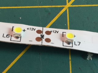 The cut marks on the LED light tape. Cut the tape in these marked spots to avoid any conductivity issues with your light strips.